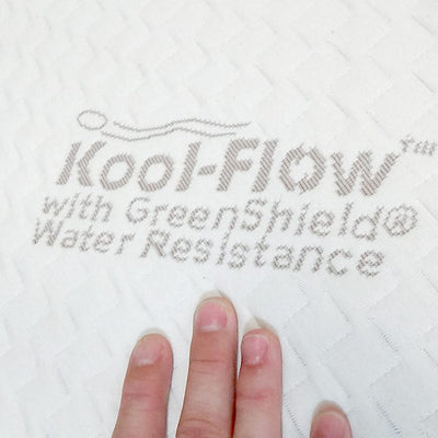 Hand touching organic cotton Kool-Flow™ fabric