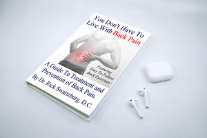 You Don't Have to Live with Back Pain Book on Table with Headphones