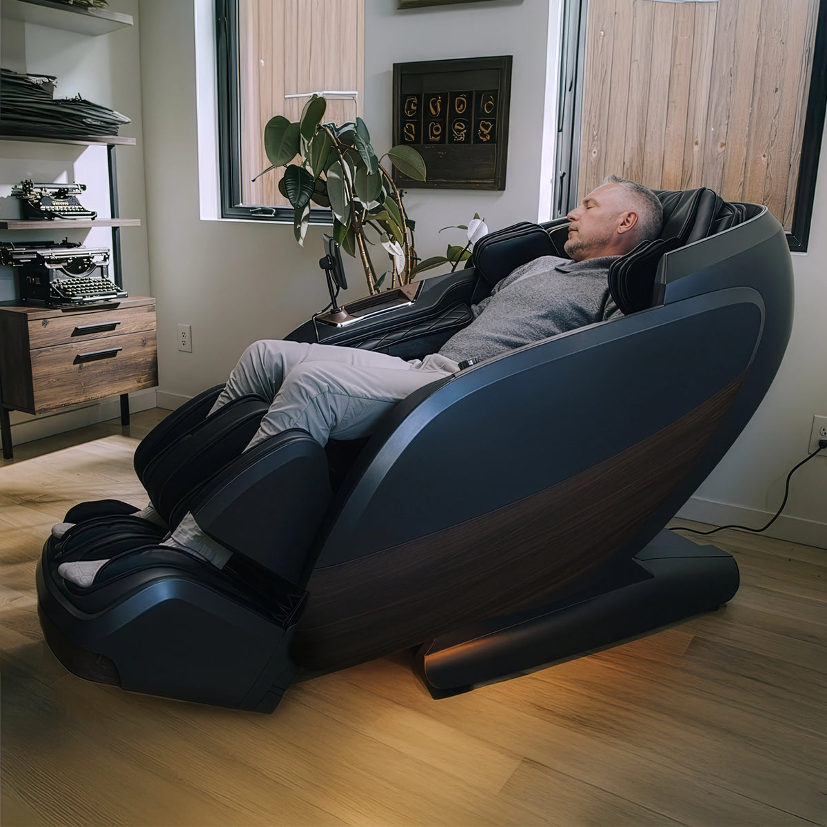 Man relaxing in DualTech Pro AI 4D massage chair