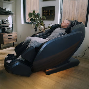 Man relaxing in DualTech Pro AI 4D massage chair