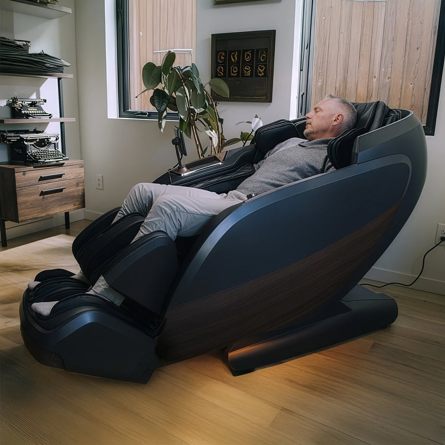 Man relaxing in DualTech Pro AI 4D massage chair