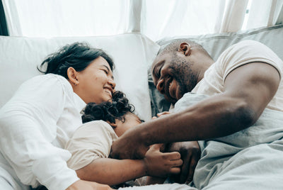 Happy family sleeping in Back Science bed