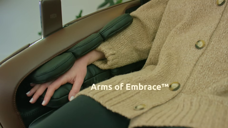 Woman enjoying Arms of Embrace™ unique arm massage technology