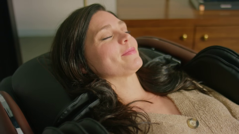 Woman enjoying massage in M8 Neo luxury massage chair