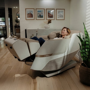 Woman relaxing in Positive Posture DualTech 4D Massage Chair in living room
